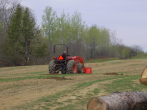 Image of a tractor plowing the field to prepare for the hops plants. Bloomfield Hops Farm started with 3 acres in 2016. We now have six acres and eight varieties of hops for your brewing pleasure.